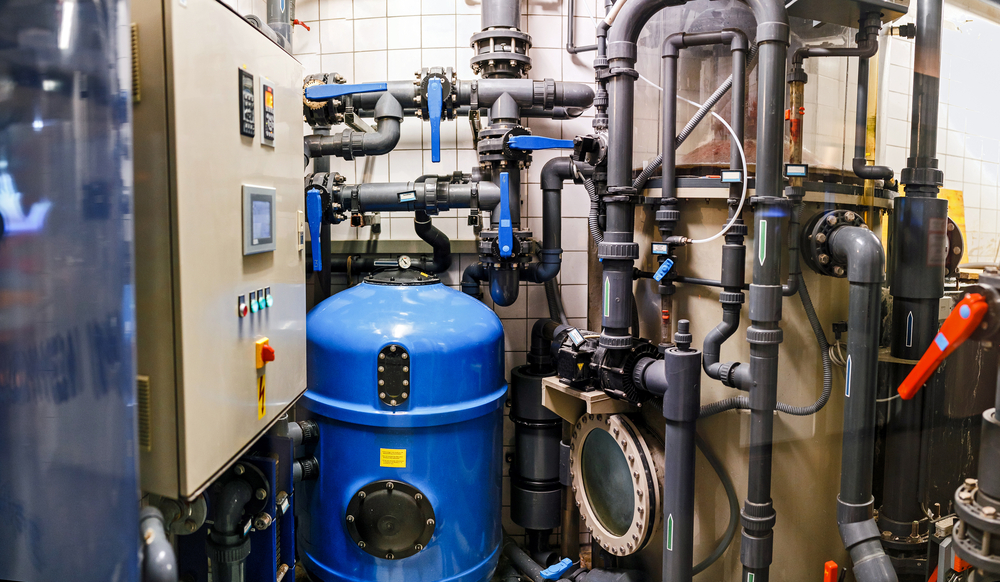industrial air compressors in cramped room